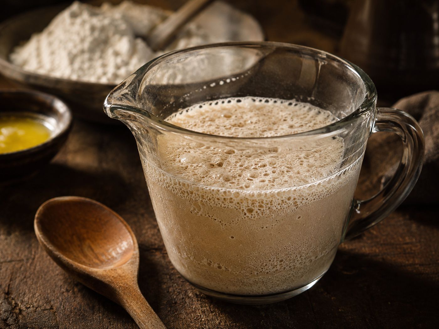 Yeast blooming and foaming in warm water for the pretzel bites dough