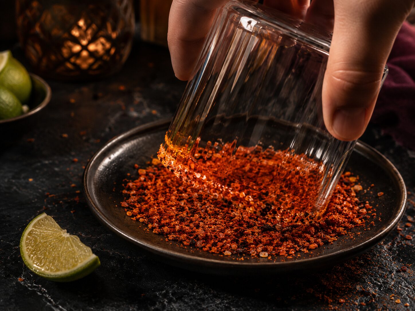 Rimming a rocks glass with chilli salt for the Dragon's Fire Margarita