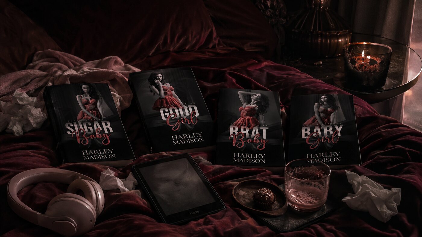 The four Sugar Life paperbacks on a red velvet bed with headphones, an ereader and a drink