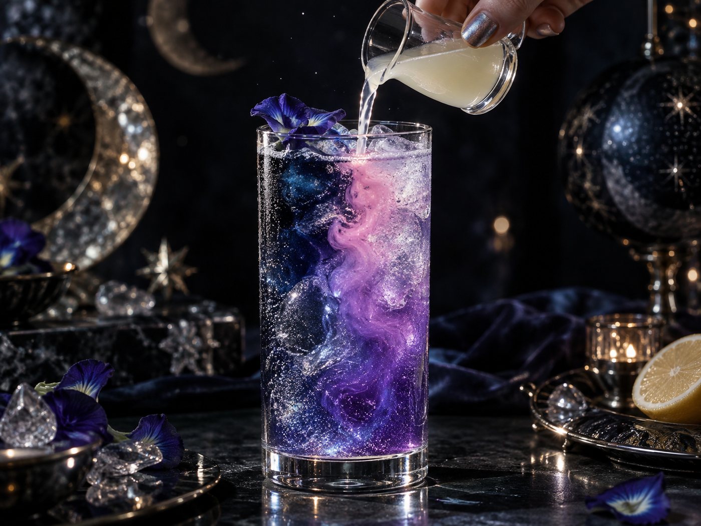 Lemon juice being poured into a blue butterfly pea cocktail, turning it violet and pink as it falls