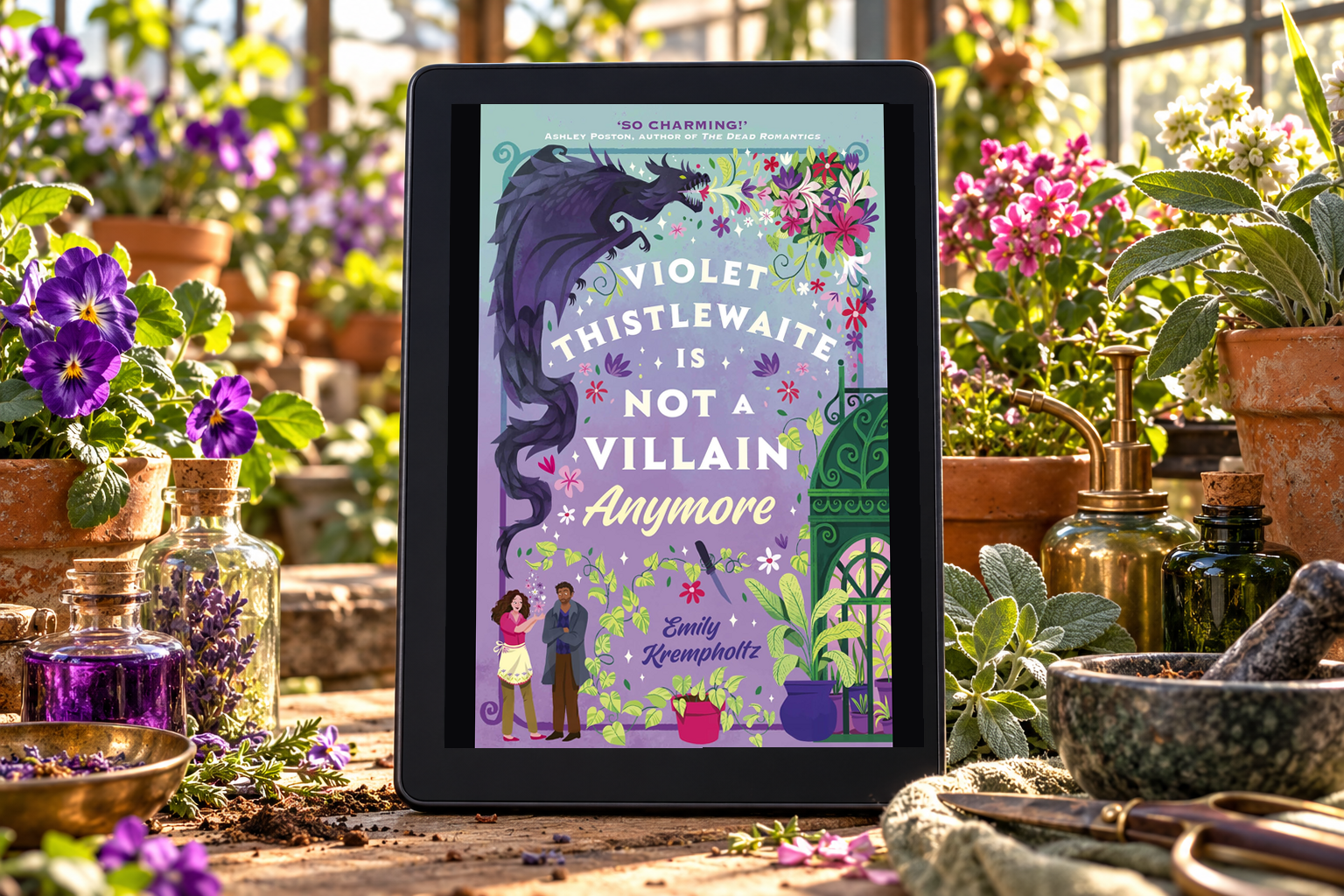 Violet Thistlewaite Is Not a Villain Anymore on a Kindle among greenhouse flowers and plants.